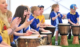 children playing african drums